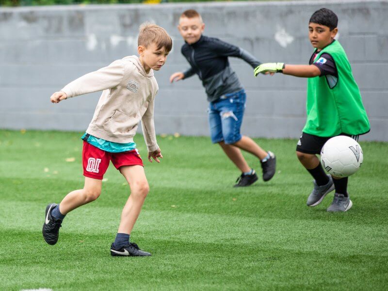 Two boys playing football